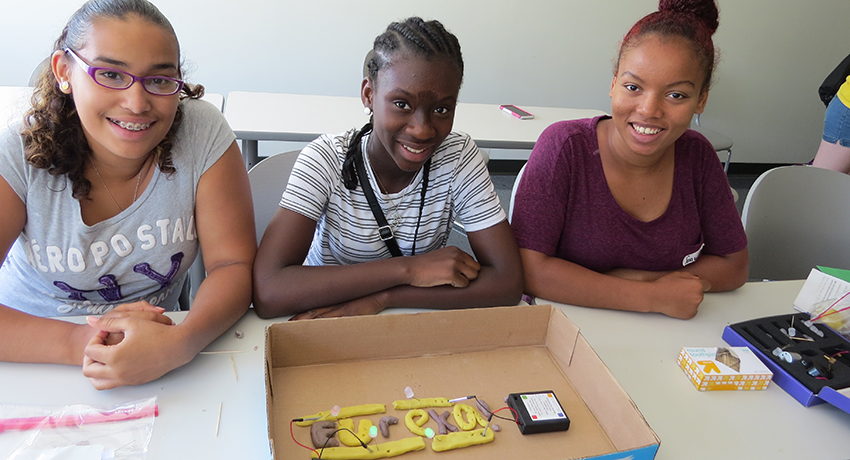 Participants in the Girls Inc. Eureka program show off their circuitry project developed at Worcester State University
