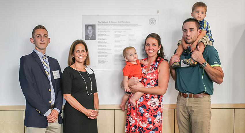 Family of Richard Korzec at the dedication of the Worcester State University golf simulator