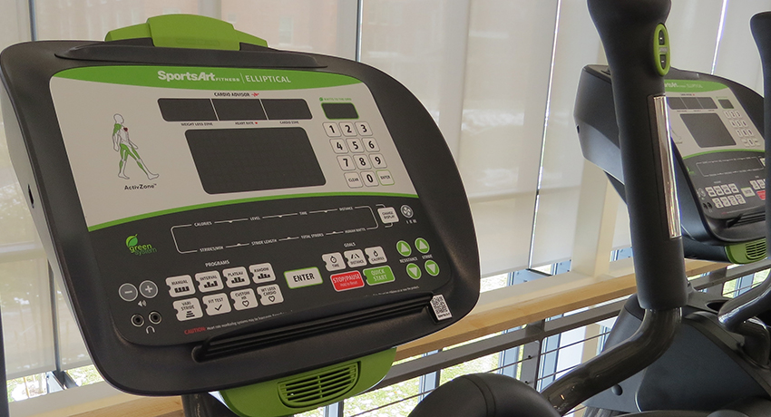 A green ellipical machine in Worcester State University's Wellness Center