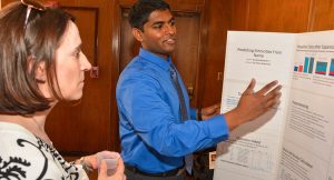 A Worcester State University computer science student discusses his project at the 2016 Celebration of Scholarship and Creativity.