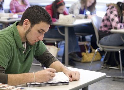 student in a Worcester State University classroom