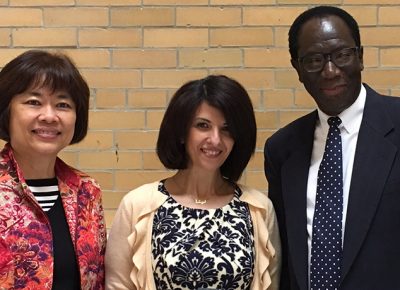 Worcester State University alumna Renah Razzaq (center) with Professor of Education Sue Foo and Associate Dean of Education Raynold Lewis