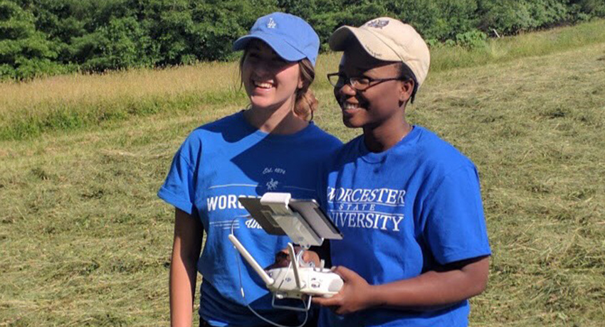 Worcester State students Farah Aubin Lauryn Mulcahy operating a drone