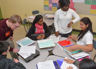 Students, teachers, and a volunteer in a Worcester public high school